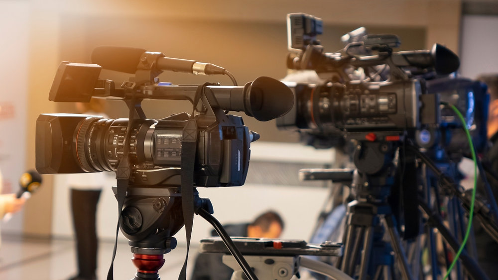 Television cameras set up to record an event during morning media coverage