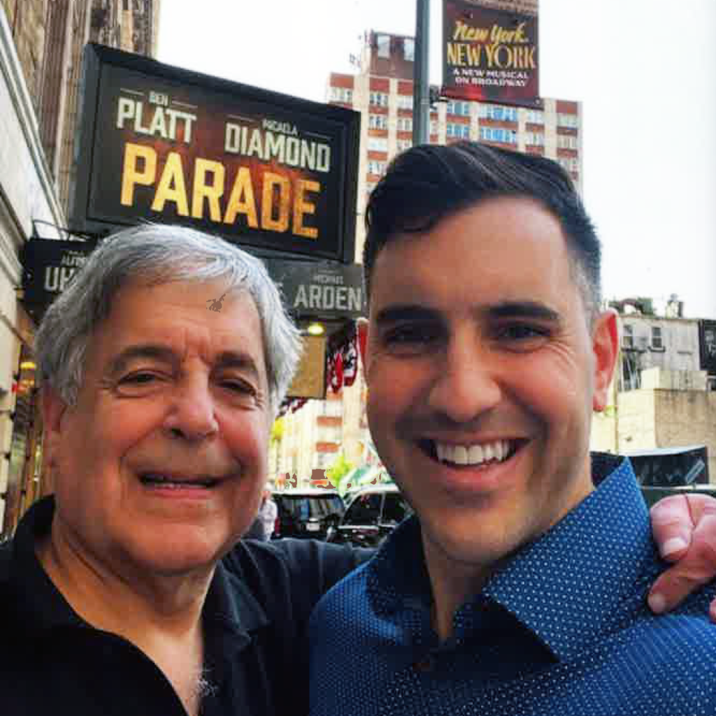 Larry Ceisler and Danny Ceisler outside the marquee of Broadway show, "Parade."