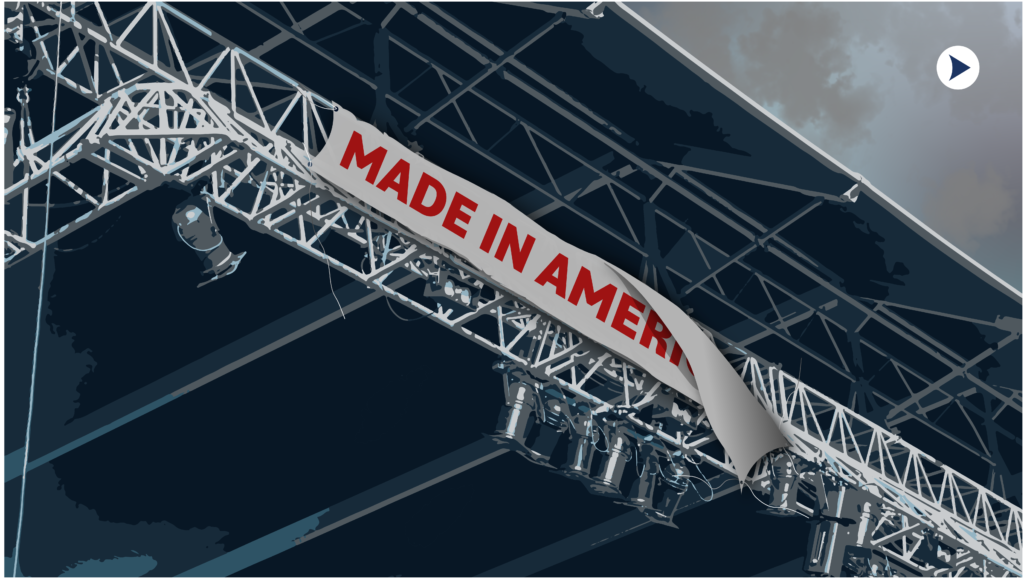 A sign that reads "Made in America" is peeling off an empty stage.